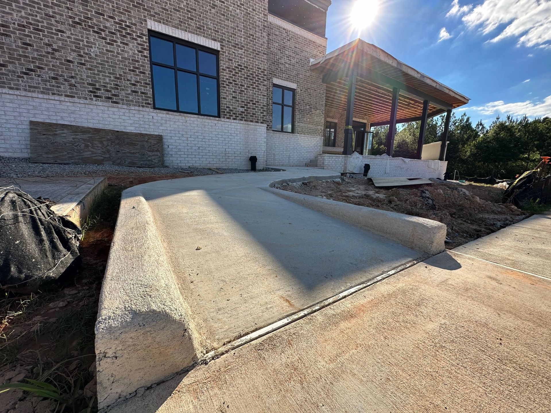 A ramp is being built in front of a brick building.