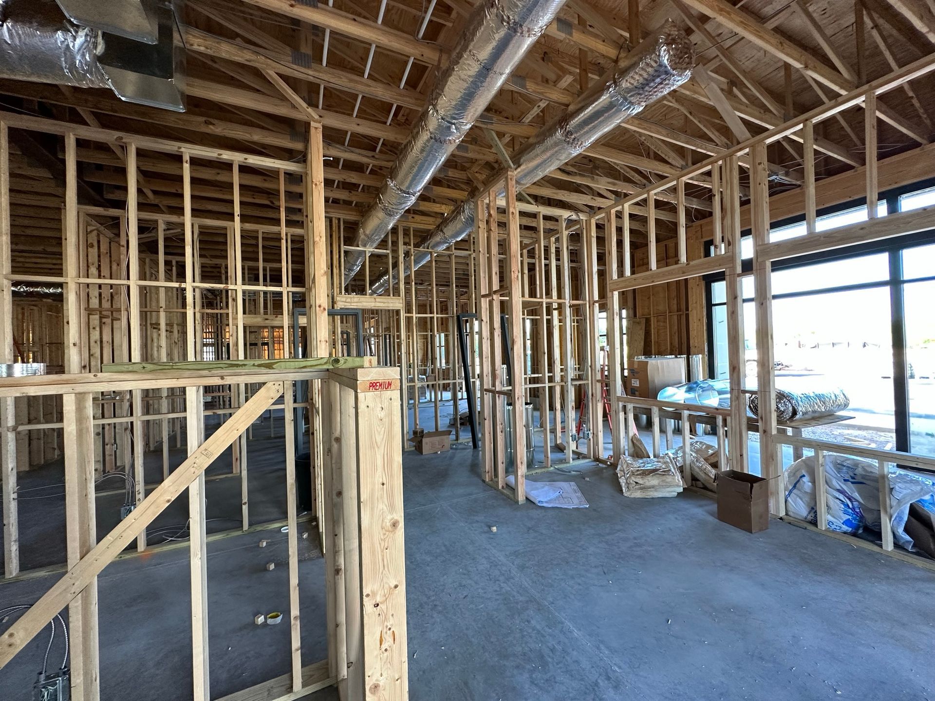 The inside of a building under construction with wooden beams.
