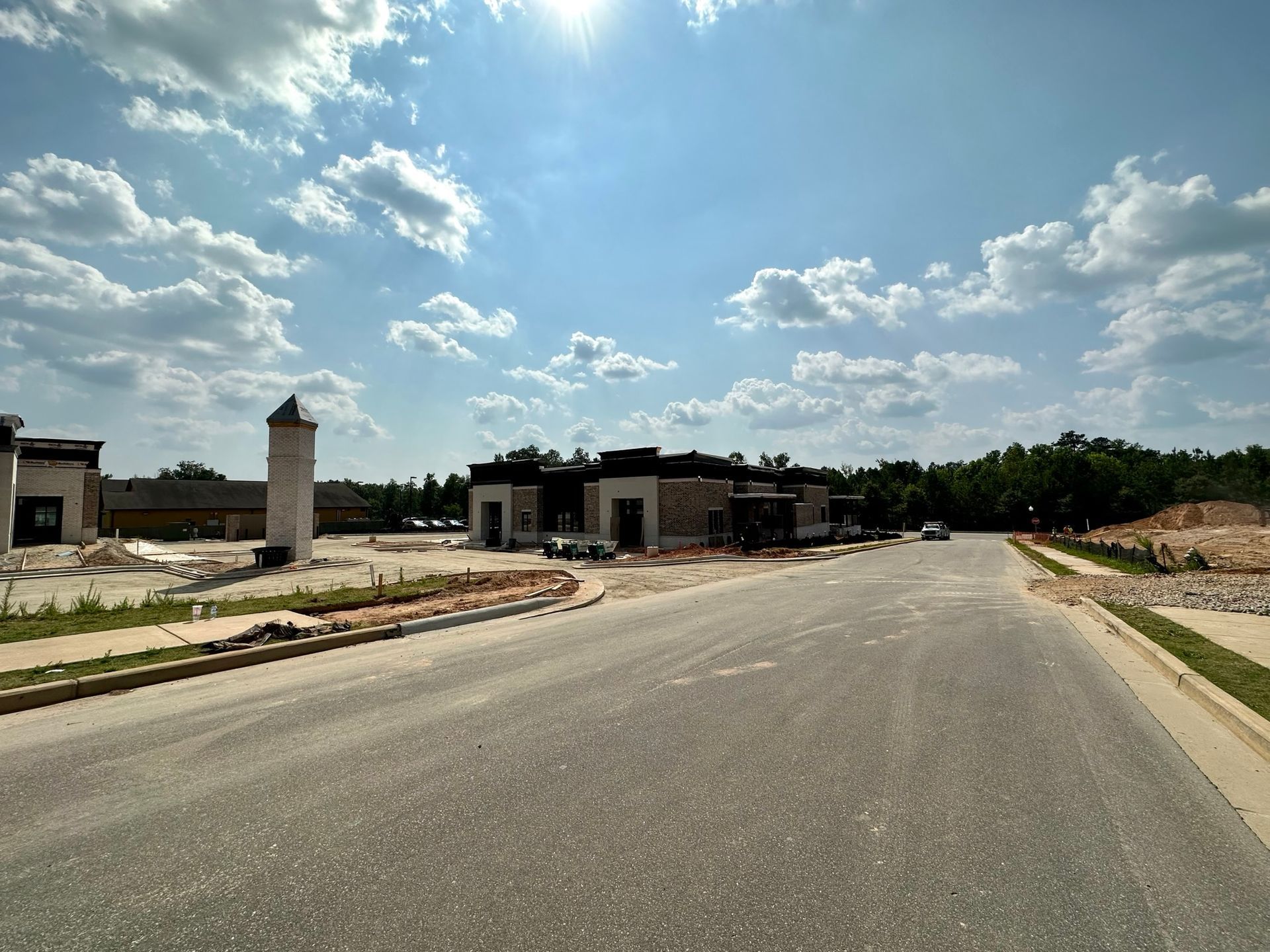 A road with a lot of buildings on the side of it