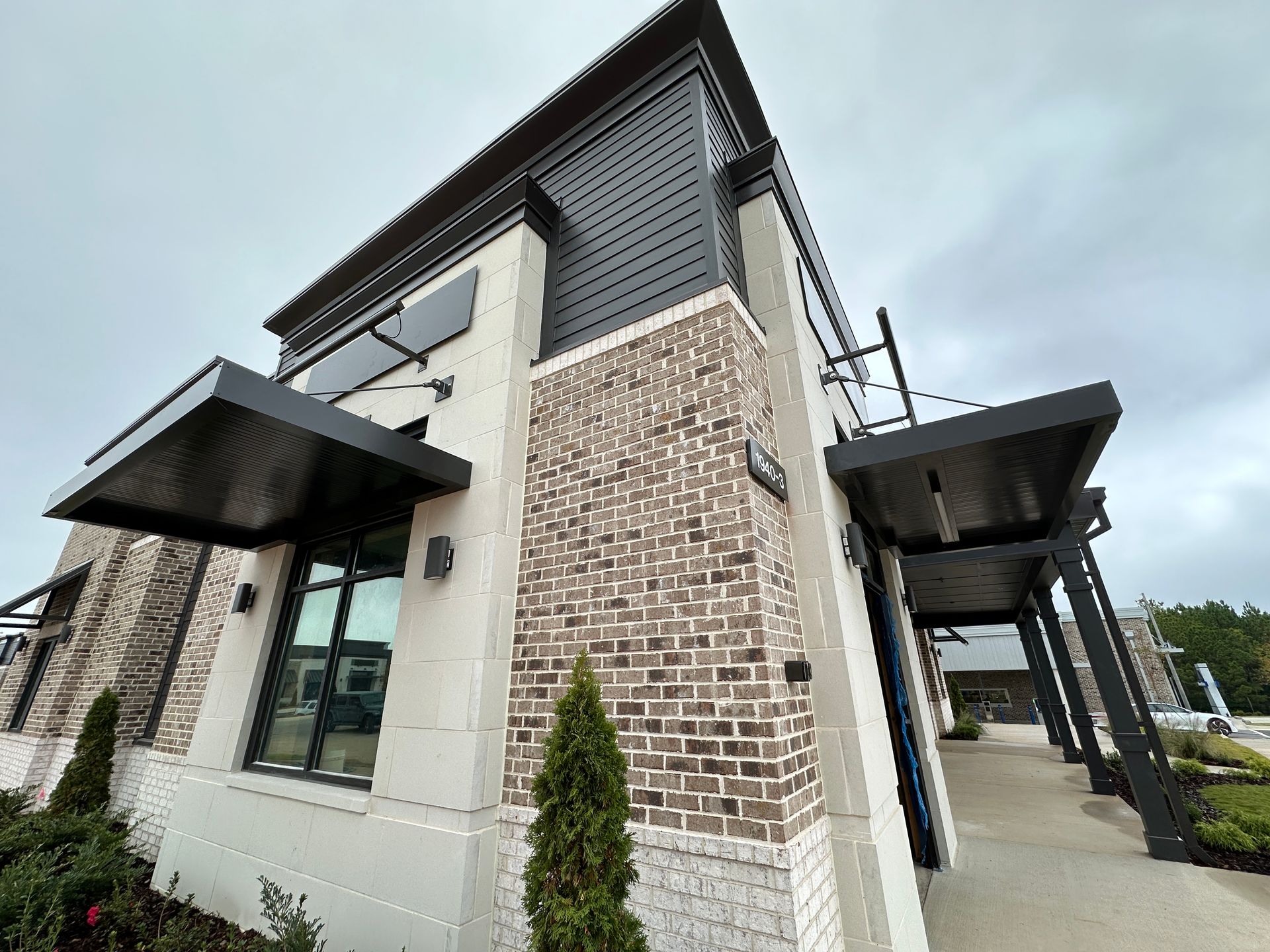 A large brick building with a canopy over the entrance.