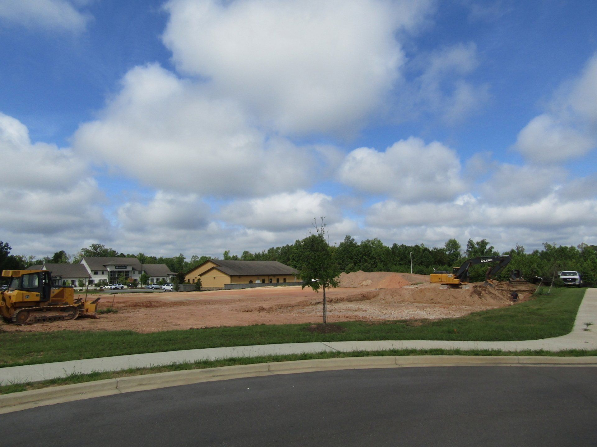 A construction site with a bulldozer in the middle of it.