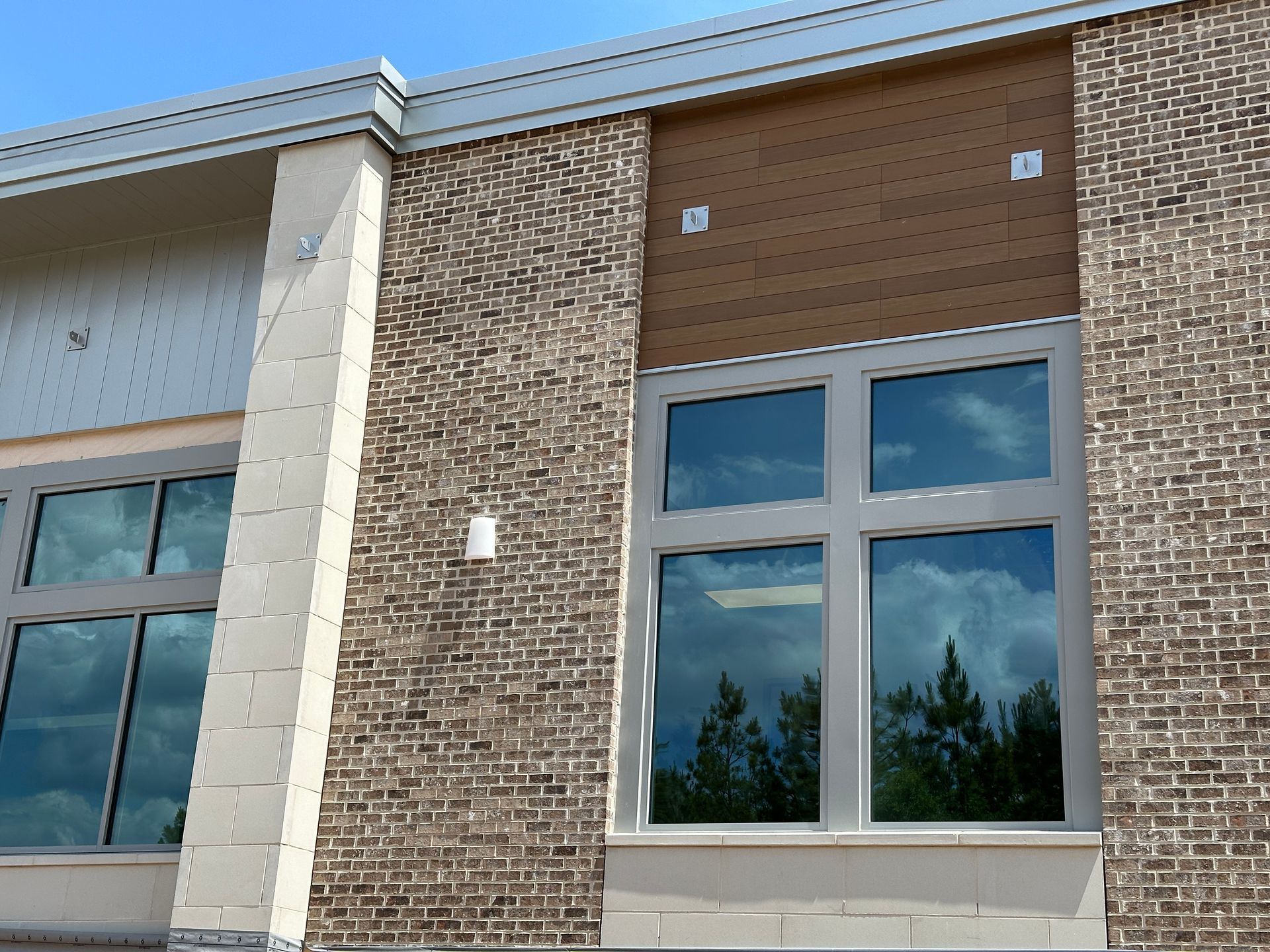A brick building with a lot of windows on it