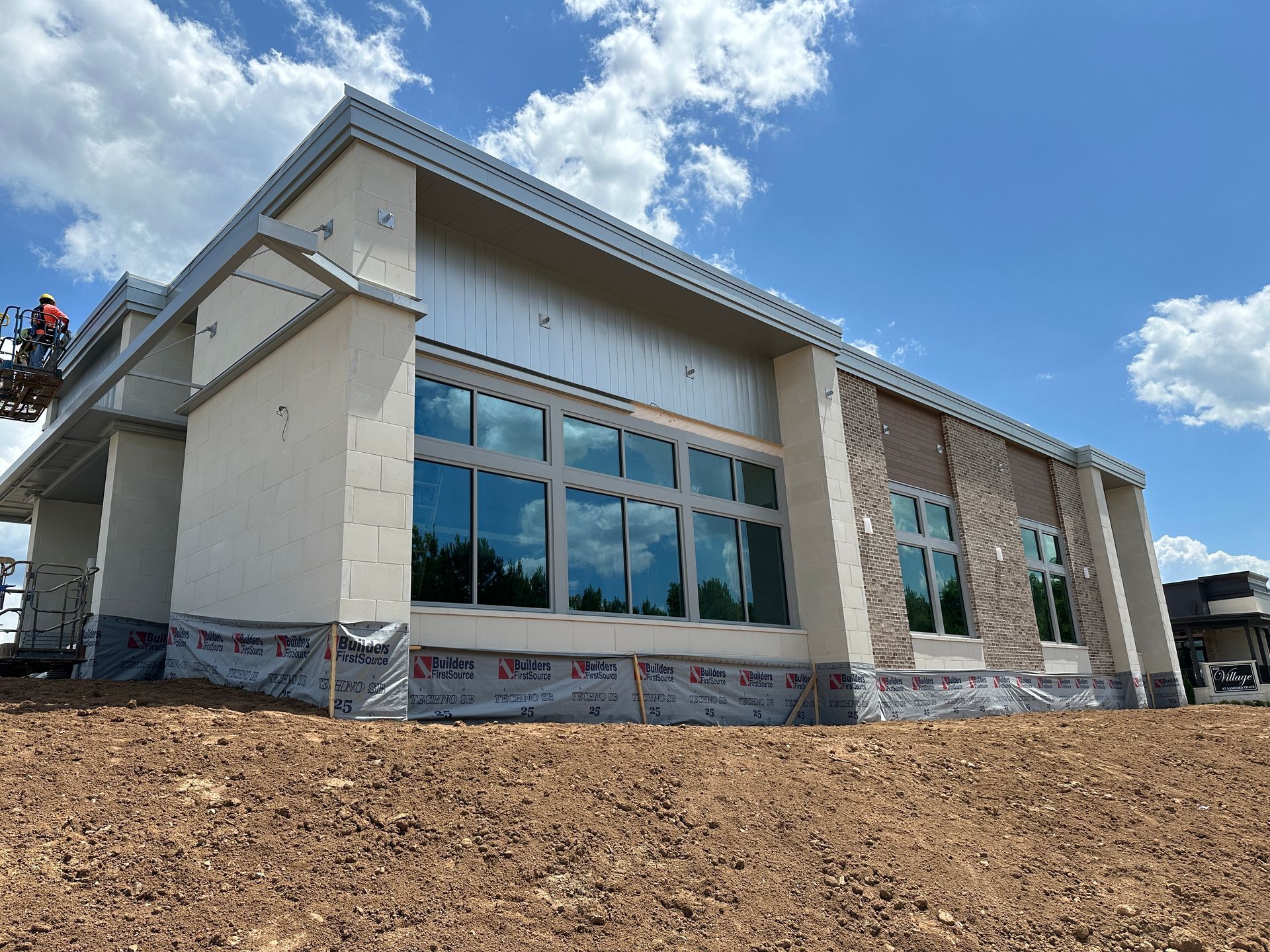 A large building with a lot of windows is being built.