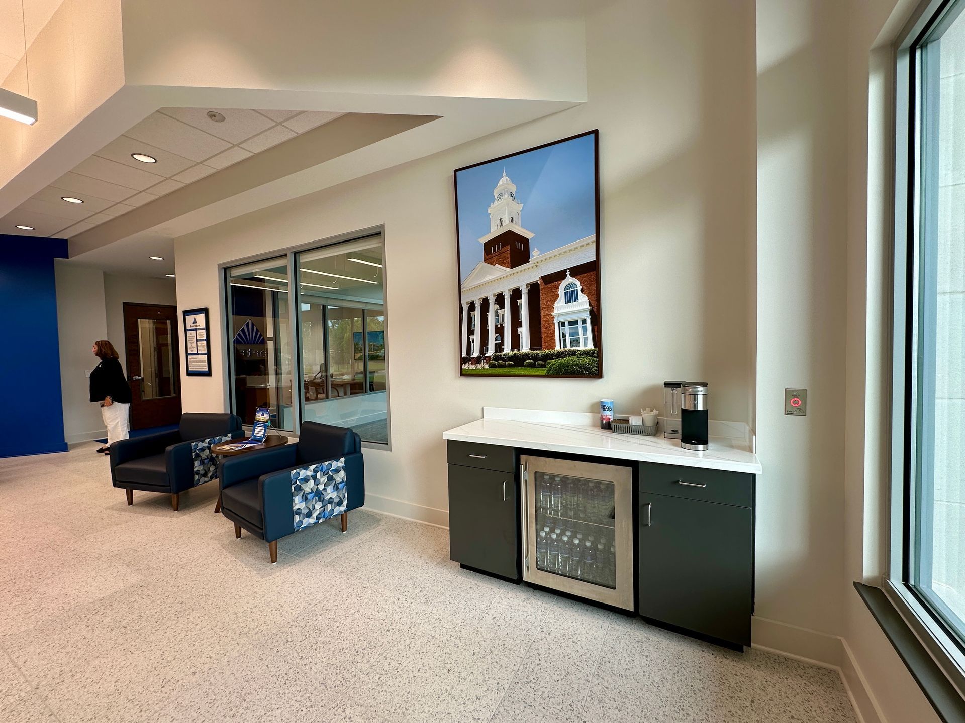 A room with a picture of a church on the wall