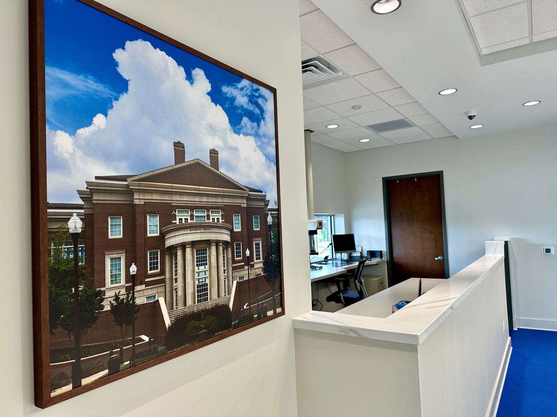 A framed picture of a building with the word federal on it