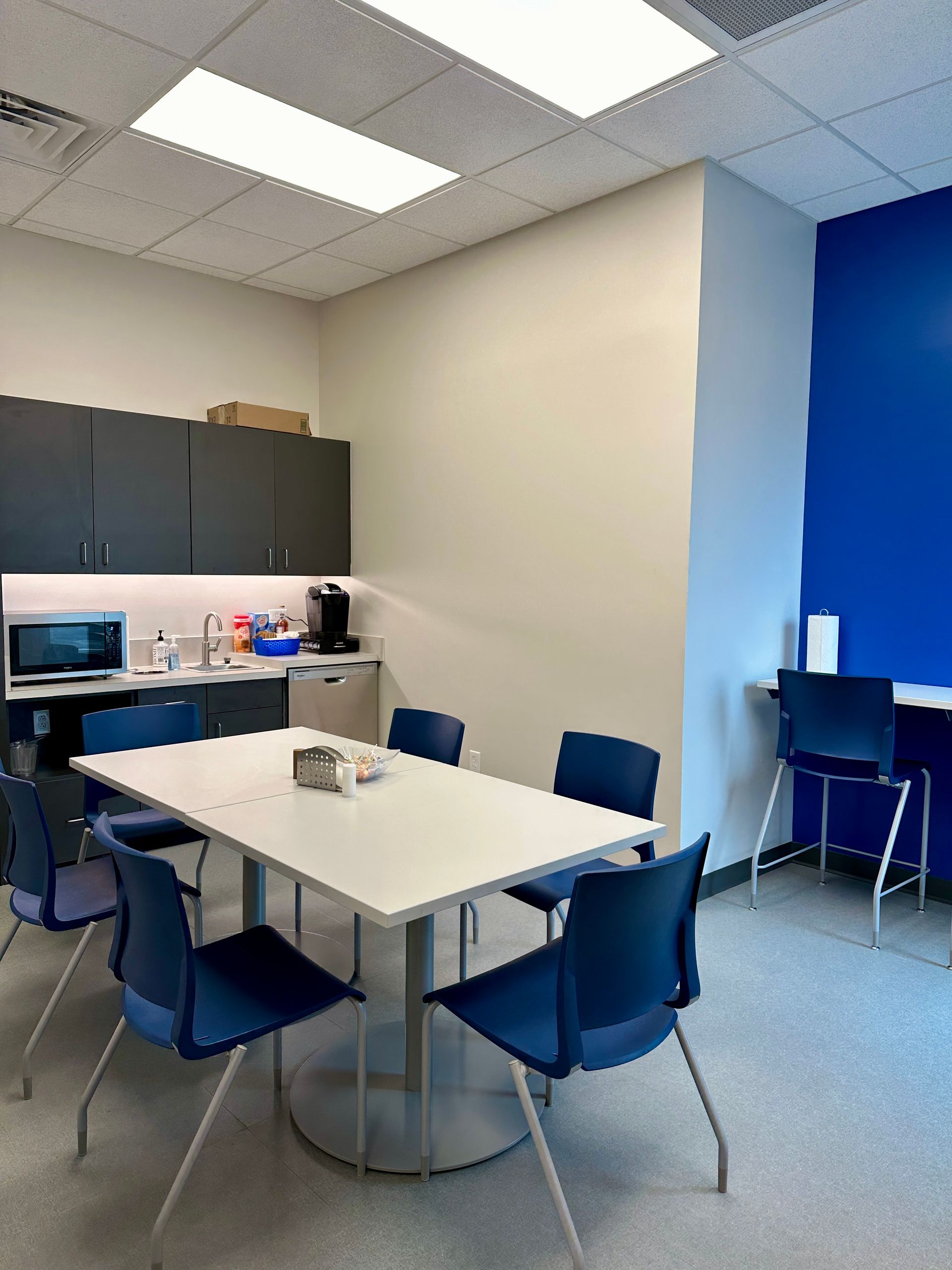 A room with a table and chairs in it