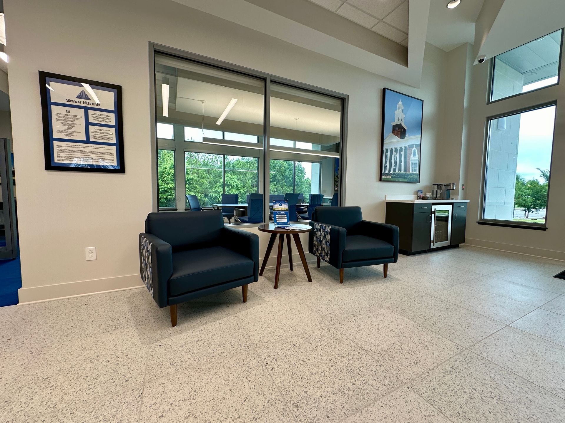 There are two chairs and a table in the room.