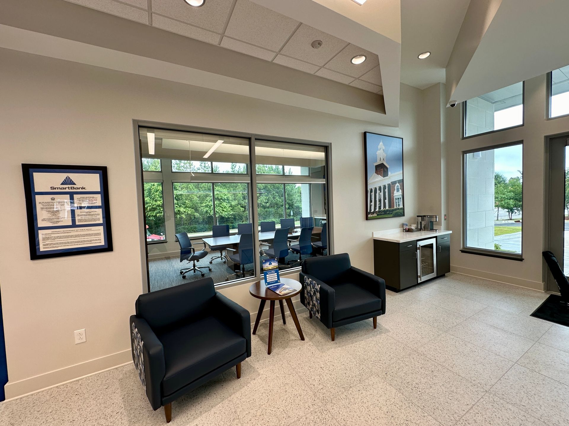 There are two chairs and a table in the room.