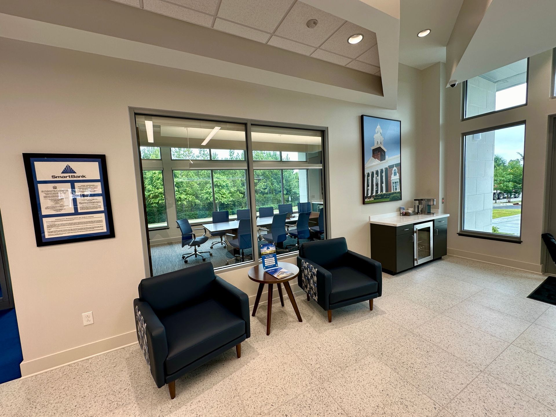 There are two chairs and a table in the room.