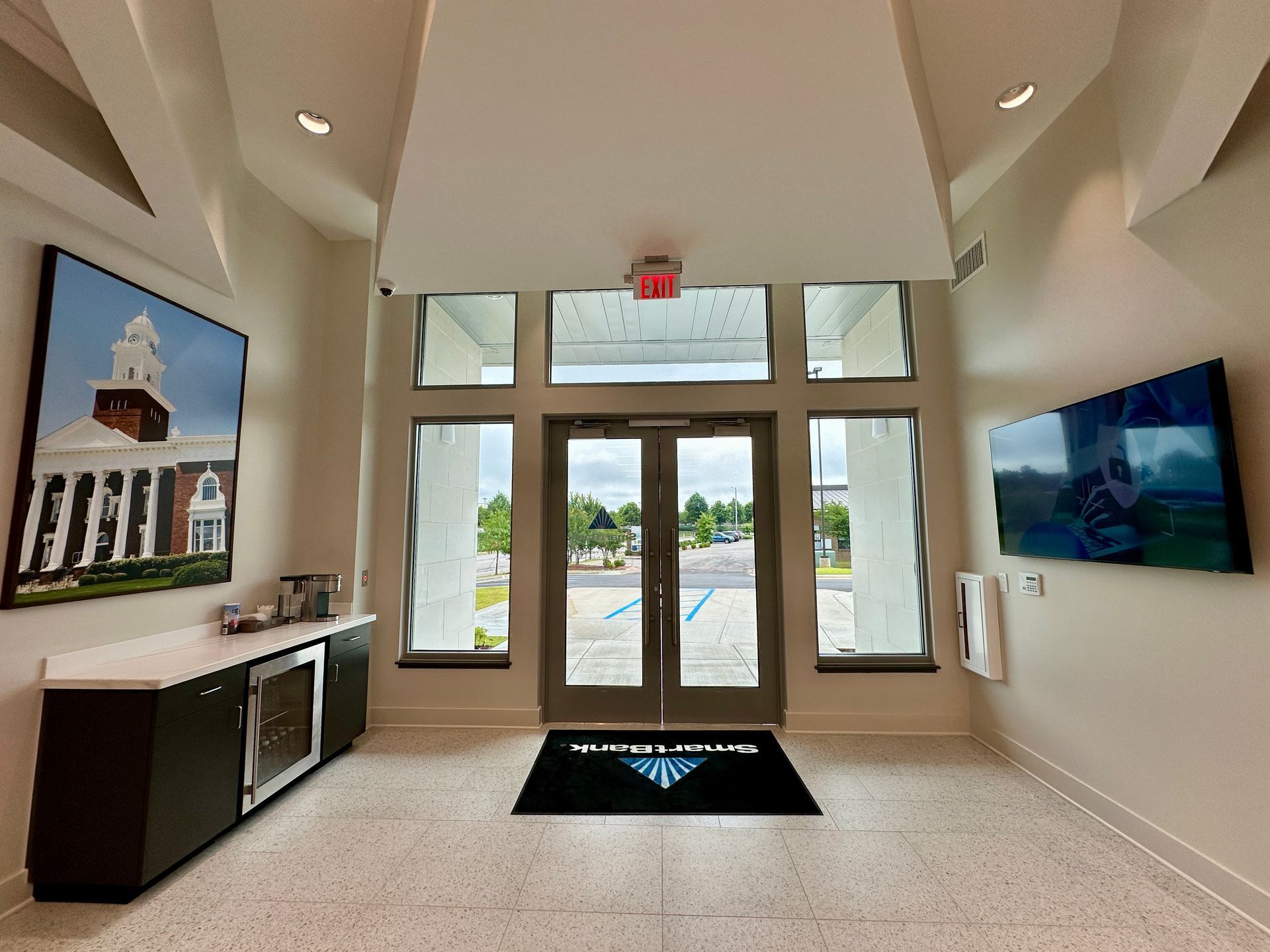 A large room with a black mat that says ' austin ' on it
