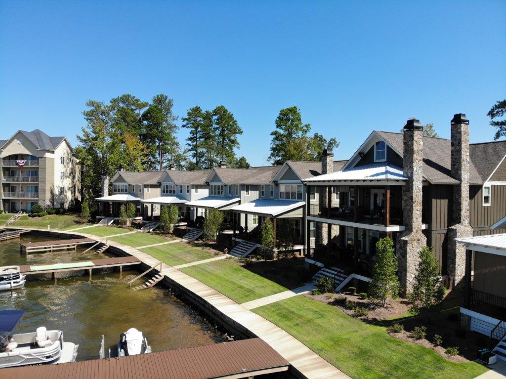 A row of houses next to a body of water