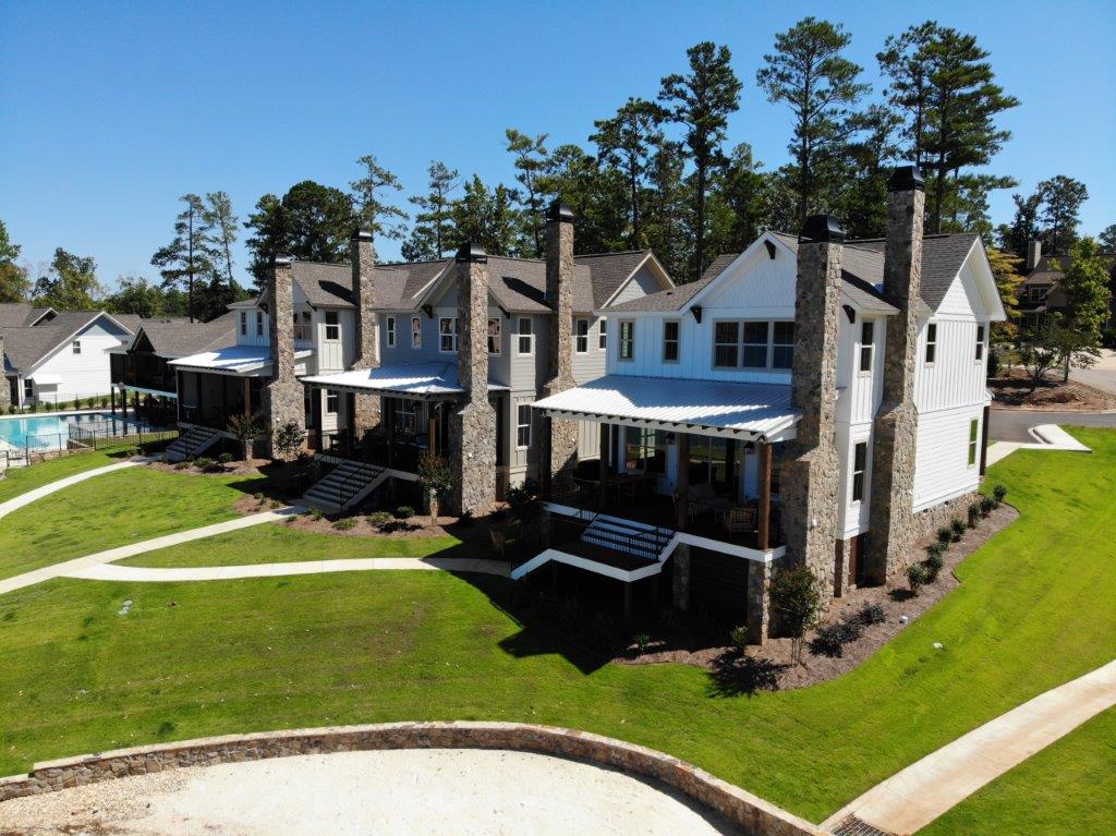 An aerial view of a row of houses with chimneys