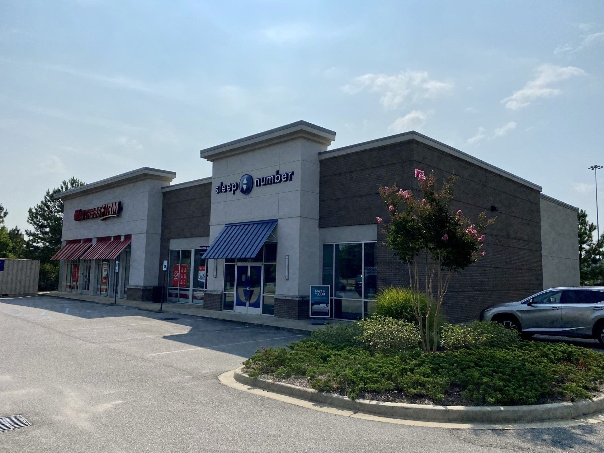 A brick building with a car parked in front of it.