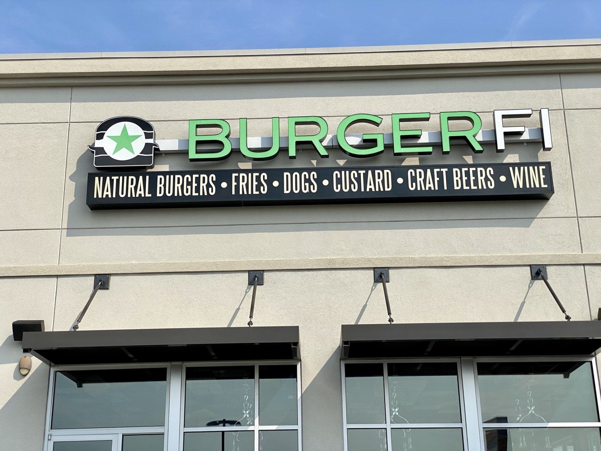 A building with a sign that says ' burger fi ' on it