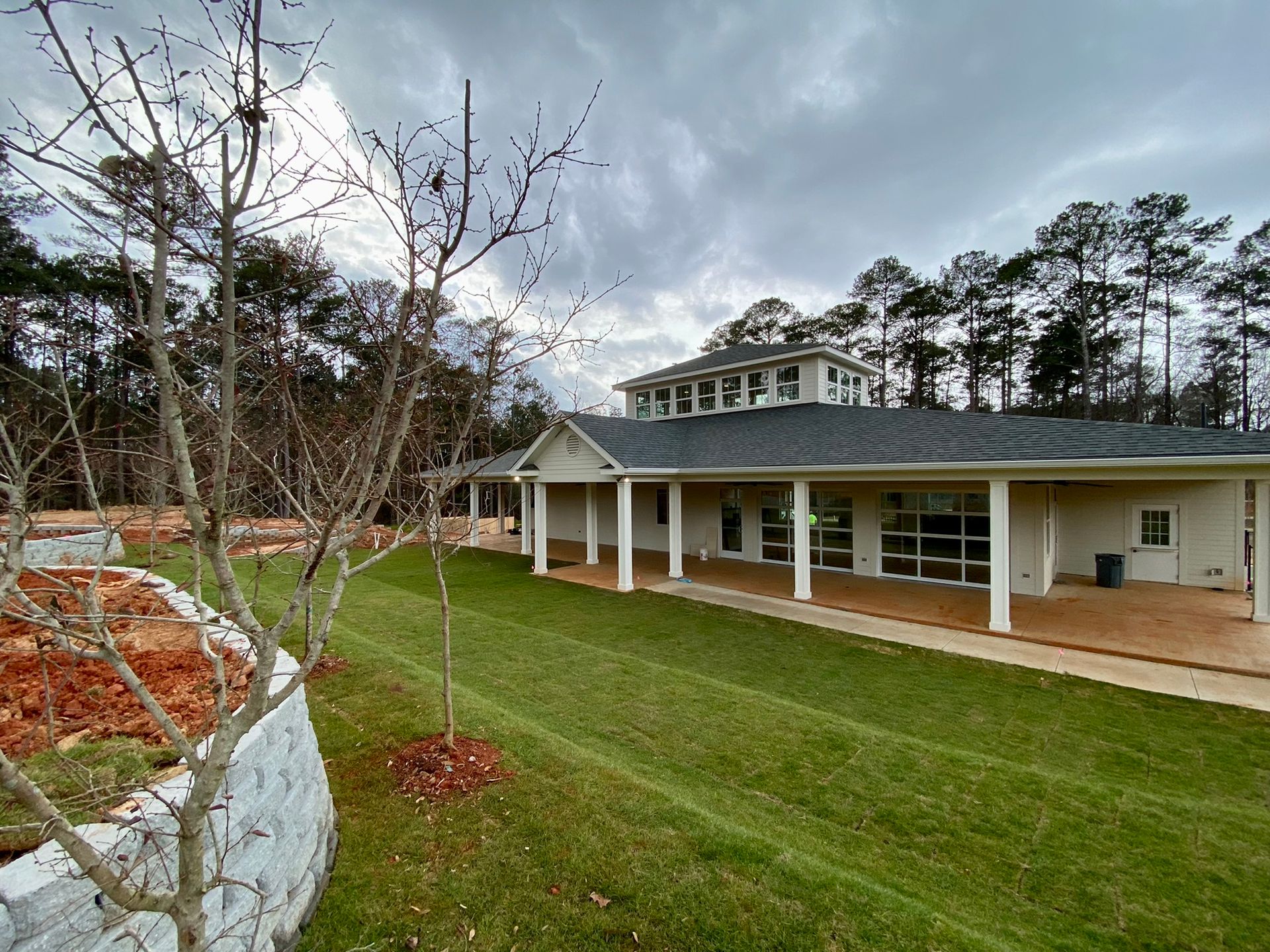 A large house with a large lawn in front of it