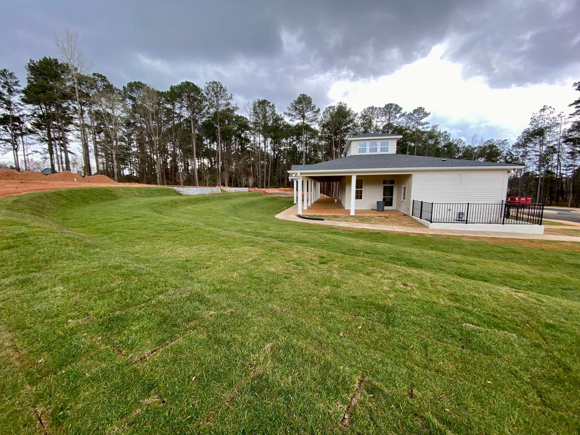 A house with a large lawn in front of it