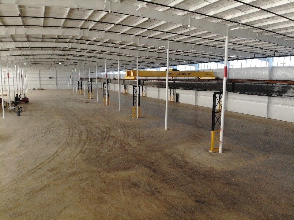 A large warehouse with a lot of empty space