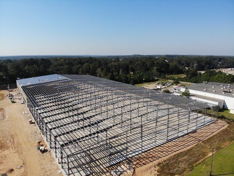 An aerial view of a large building under construction.