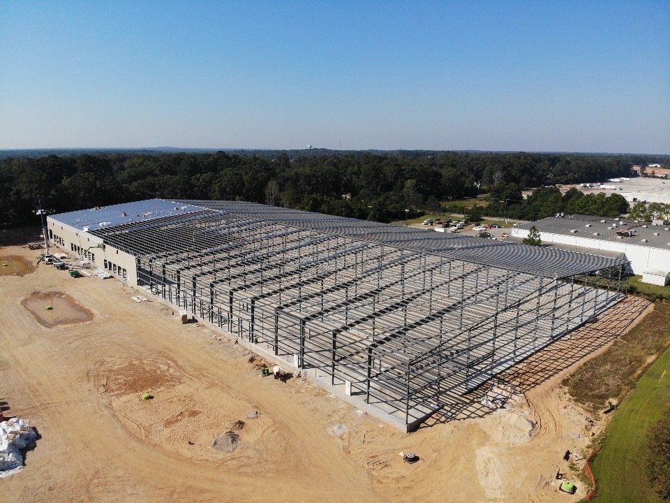 An aerial view of a large warehouse under construction.