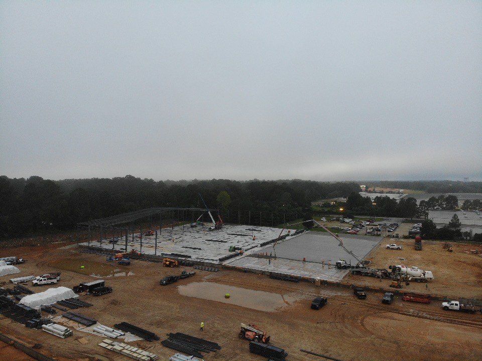 An aerial view of a construction site on a cloudy day.