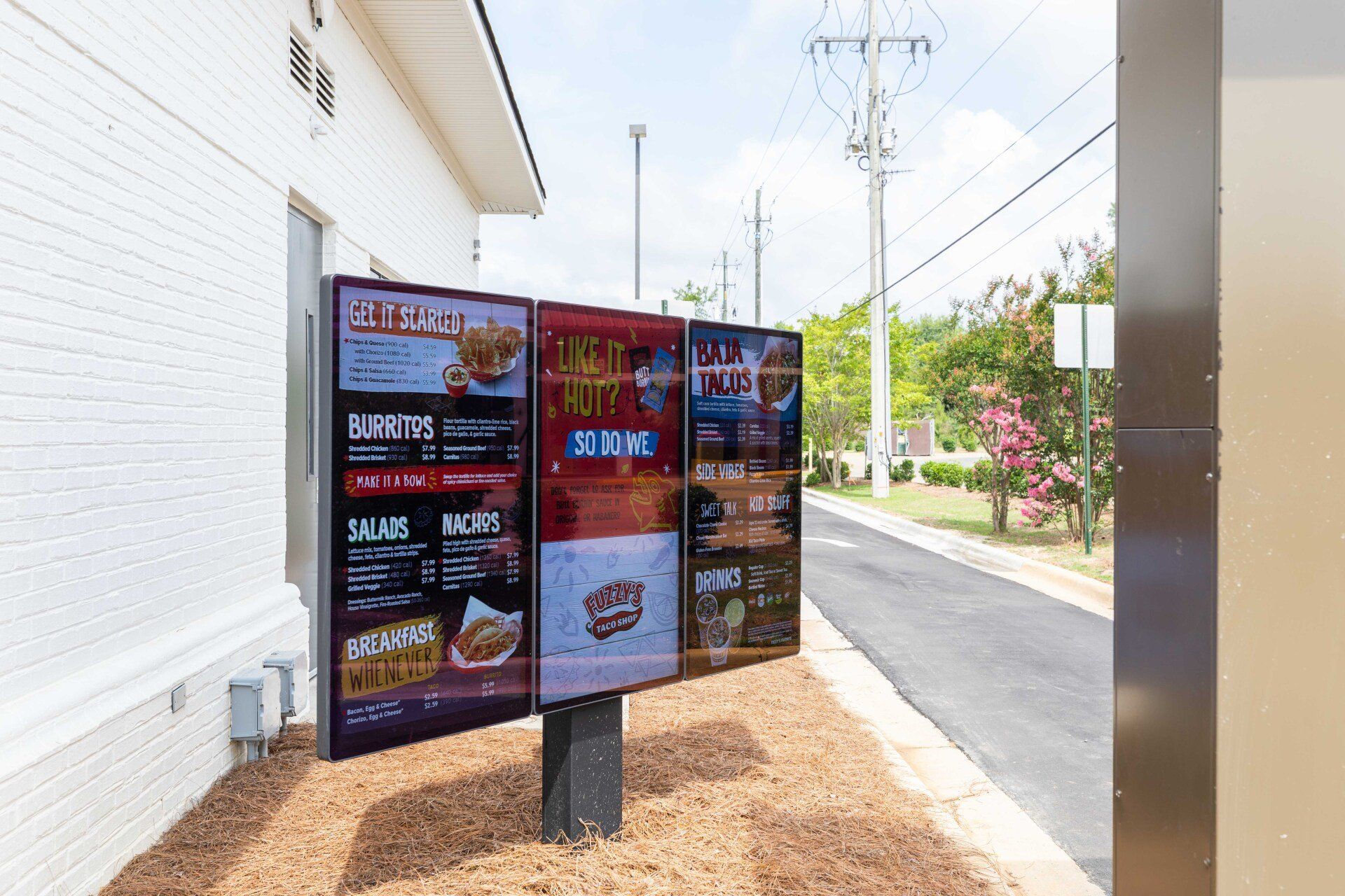 A drive thru menu at a fast food restaurant.