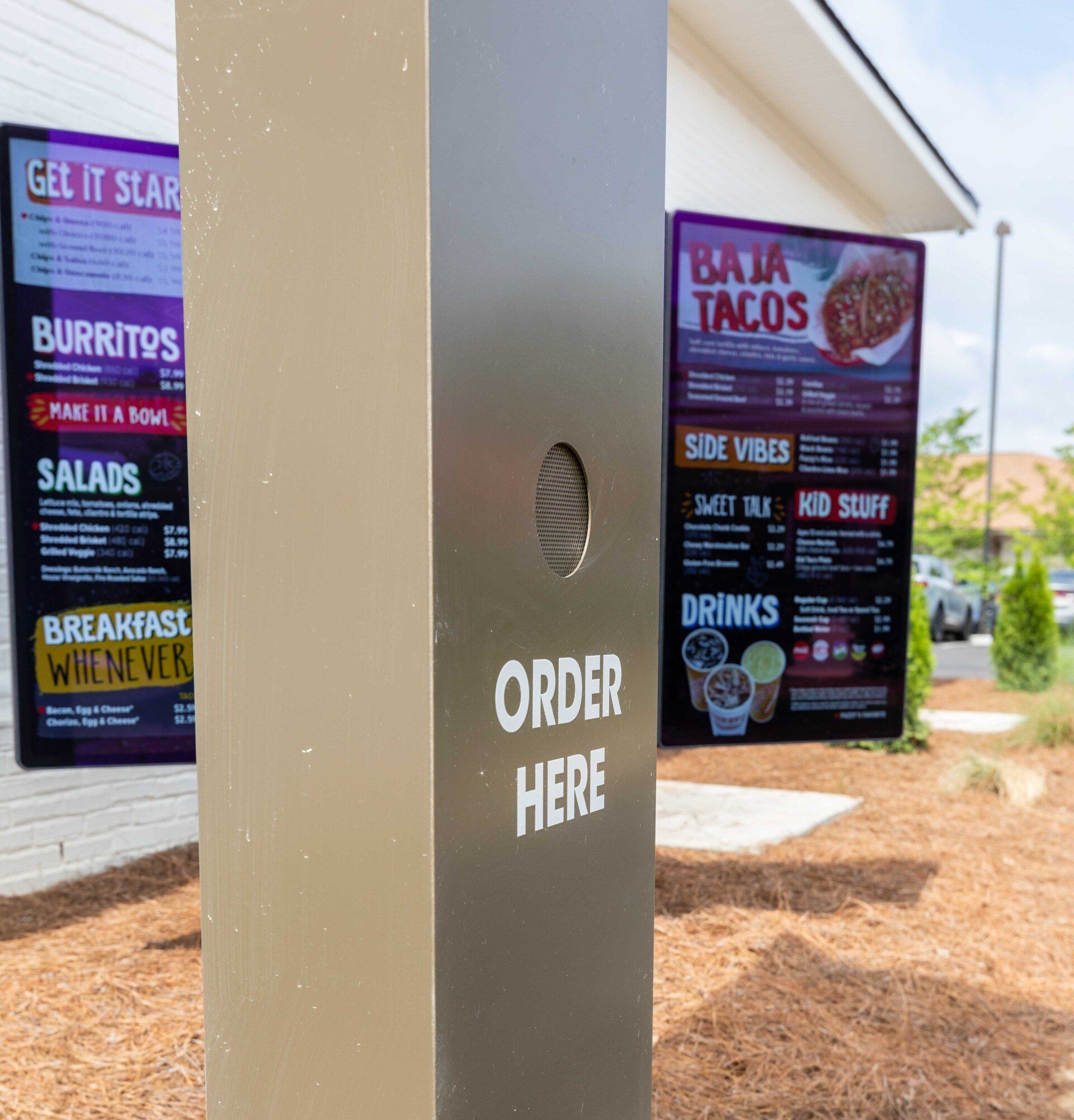 A sign that says baja tacos on it