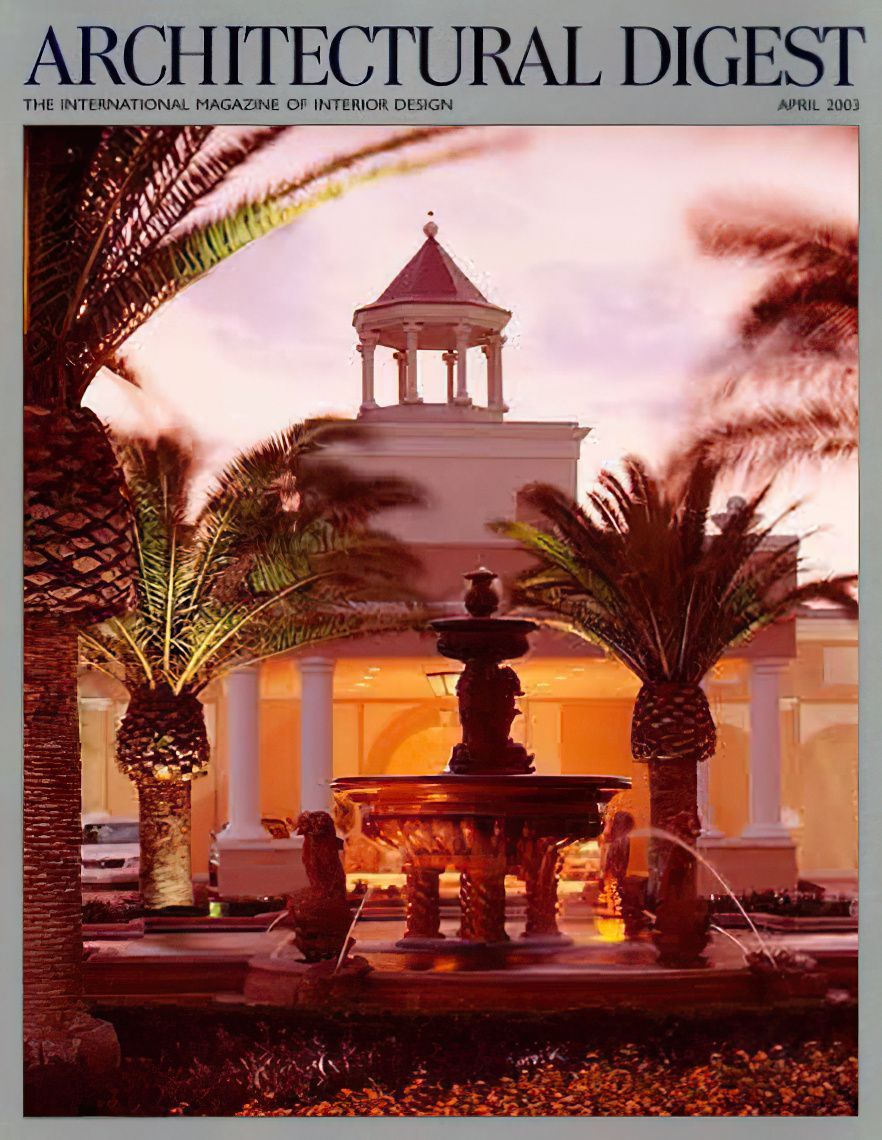Architectural Digest cover: Ornate fountain, tropical palm trees, and classical building at sunset.