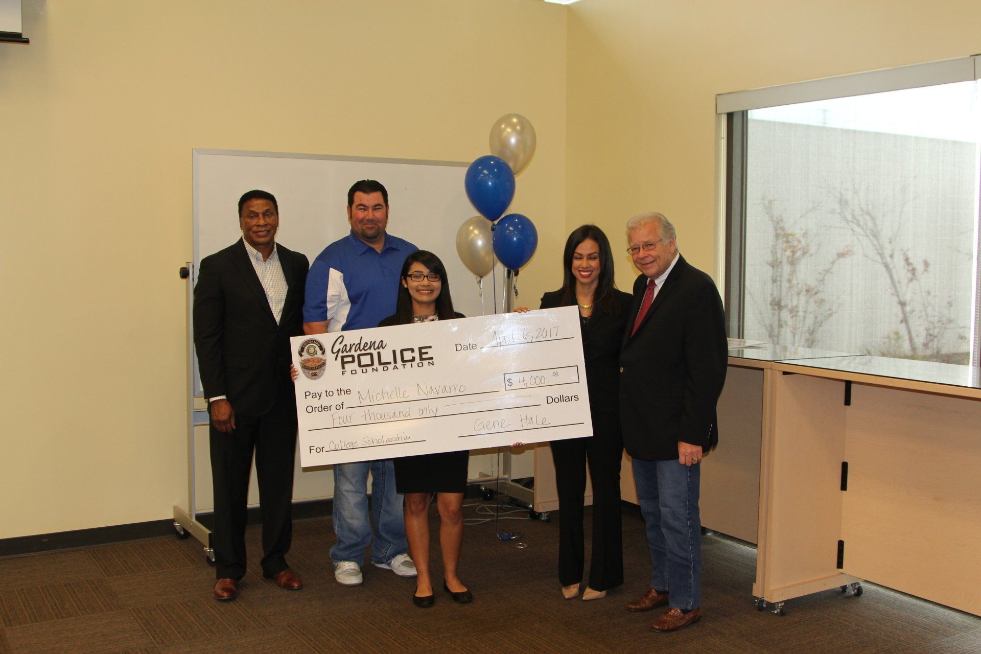 A group of people holding a check that says great police