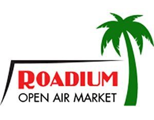 A logo for roadium open air market with a palm tree