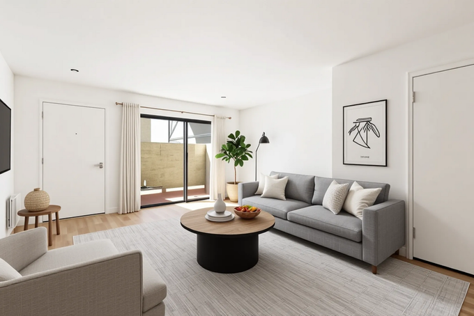 A living room with a couch , chair , coffee table and television.