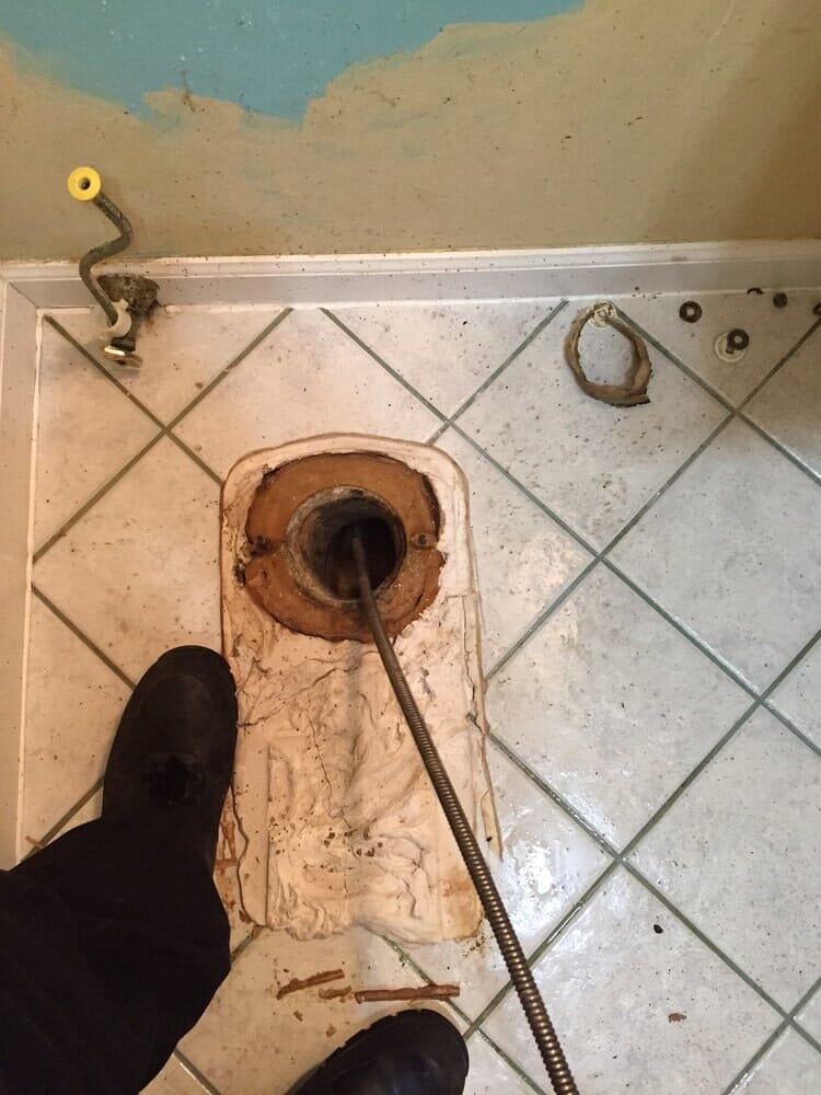 man snaking drain-Drain Away Sewer Service, Inc. in Stamford, Connecticut