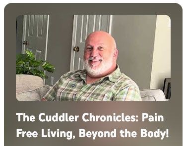 A man with a beard is sitting on a couch in a living room.