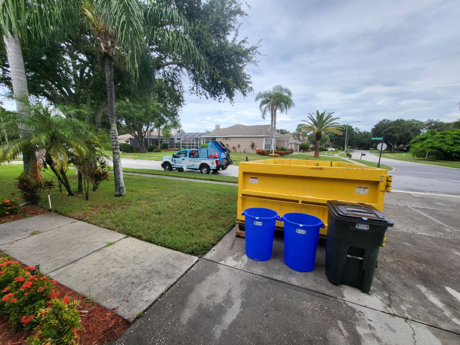 A city street with a lot of buildings and trees-Fresh Water Bins A Trash Bin Cleaning Service