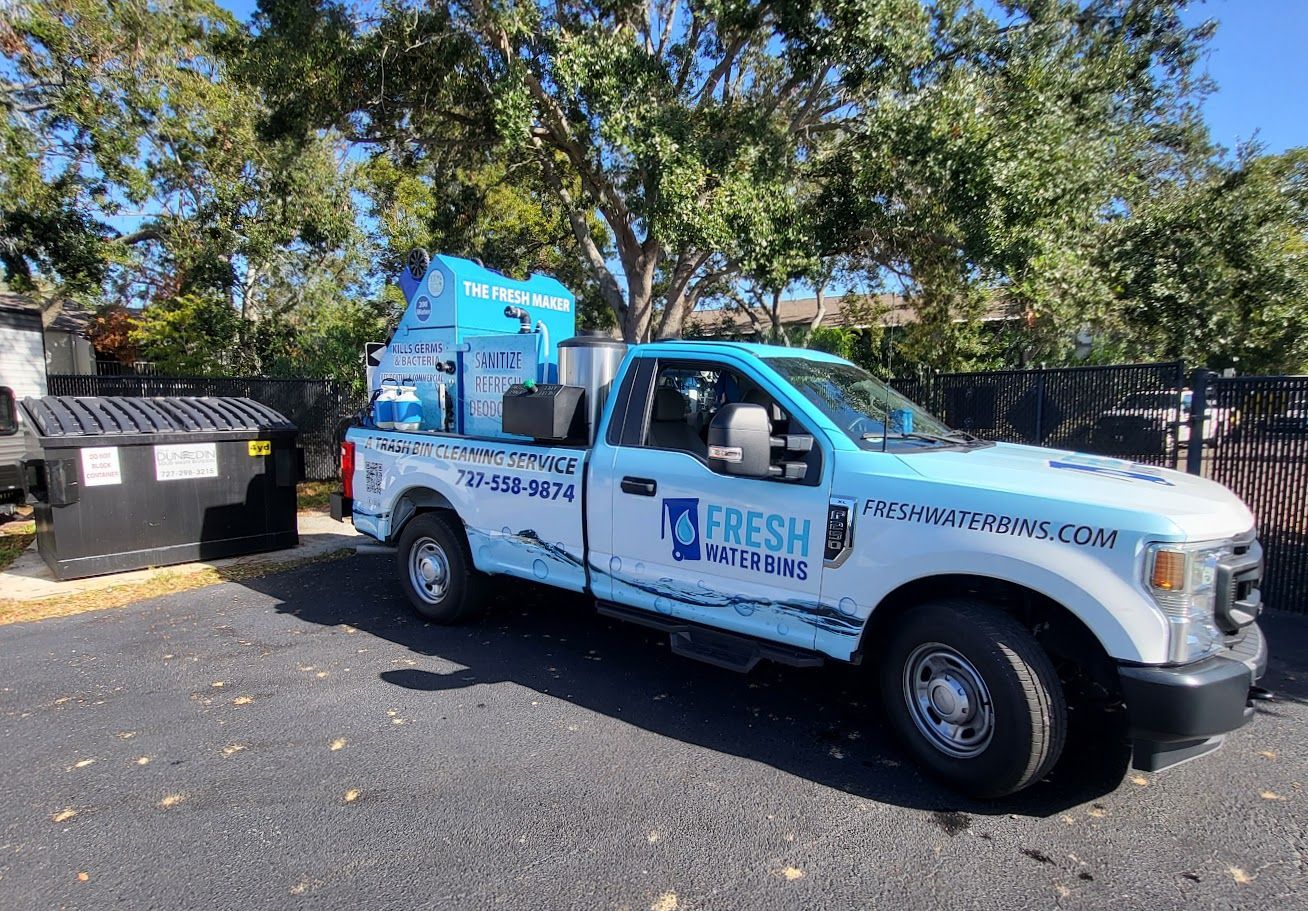 A close up of a blue object being sprayed with water.
