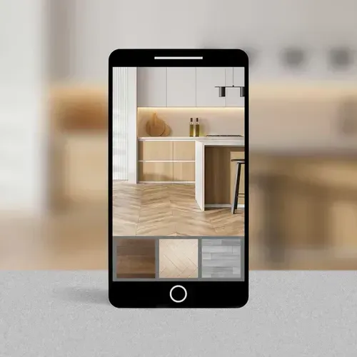Smartphone displaying a kitchen design with selectable flooring options. The phone sits on a white surface.