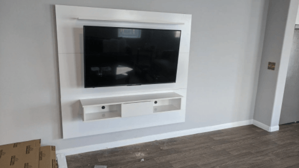 Modern entertainment center installed with TV mounted