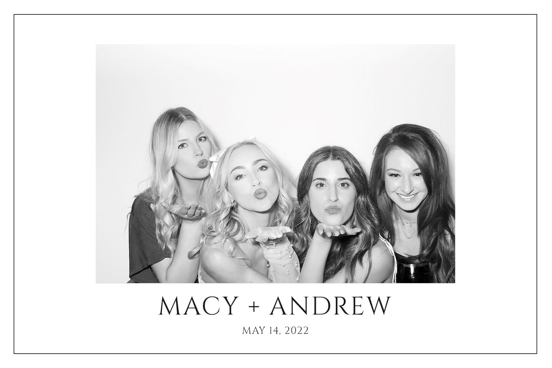 A group of women are posing for a picture in a photo booth.