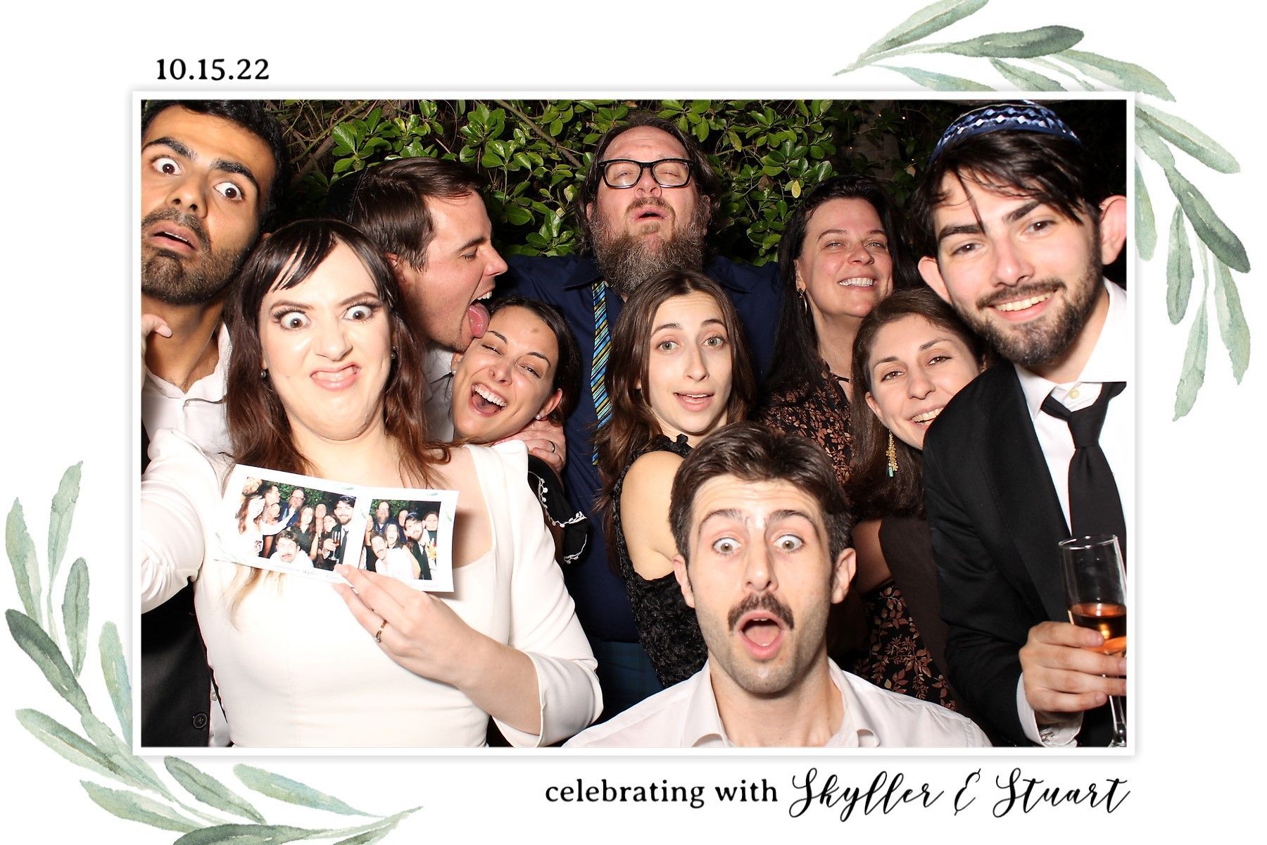 A group of people are posing for a picture in a photo booth.