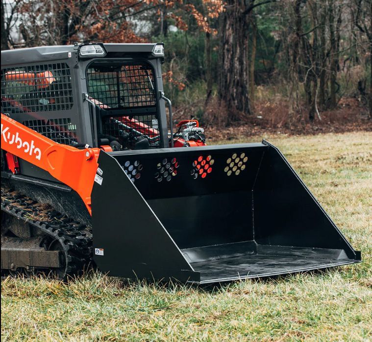Compact track loader with bucket attachment at Flex Equipment Rental