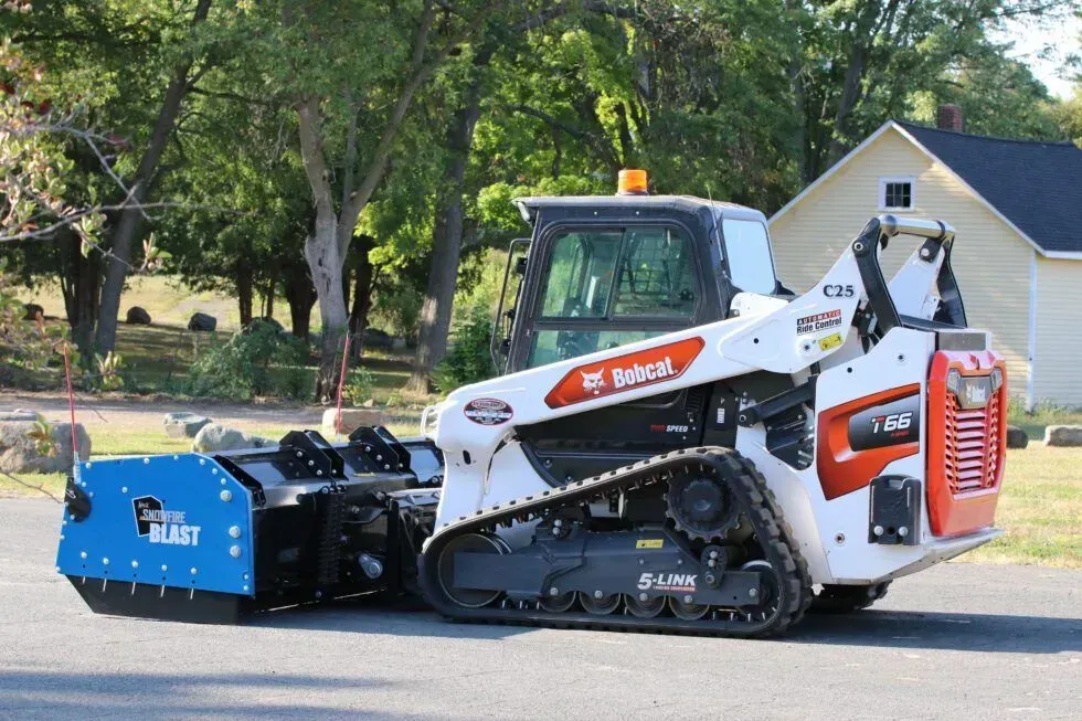 Kage SnowFire blast system on Bobcat T66 track loader clearing snow