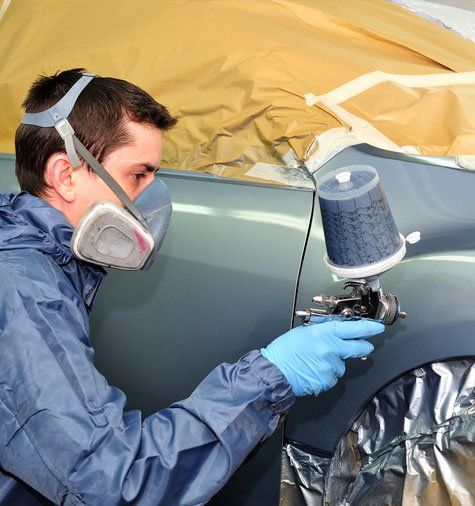 Worker Painting A Car — Rawlins, WY — Jacks Body Fender Repair