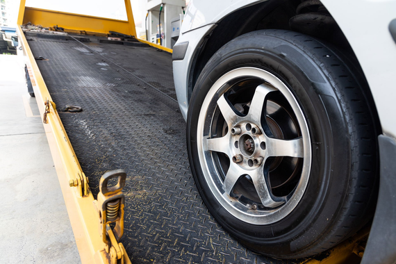 Car Towed Onto Flatbed Tow Truck — Rawlins, WY — Jacks Body Fender Repair