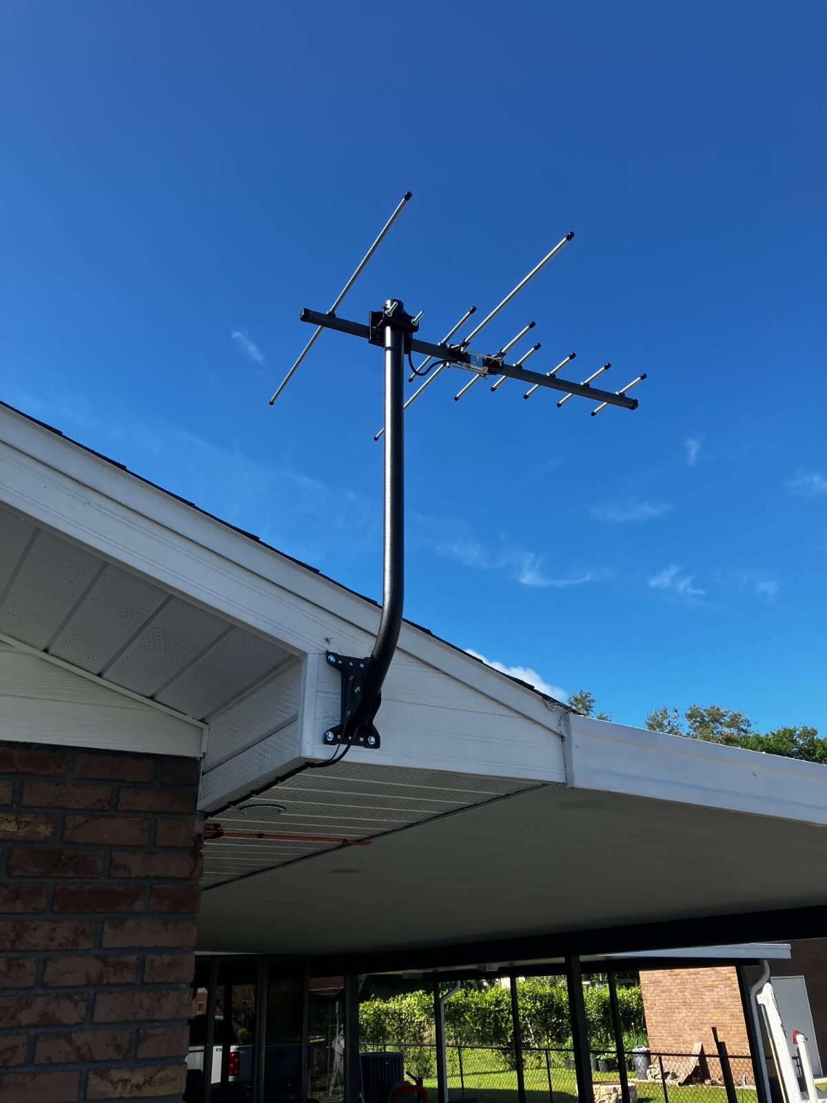 An antenna is mounted on the roof of a house