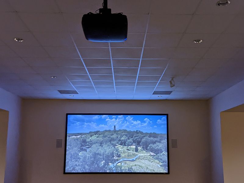 A large screen with a picture of a mountain on it