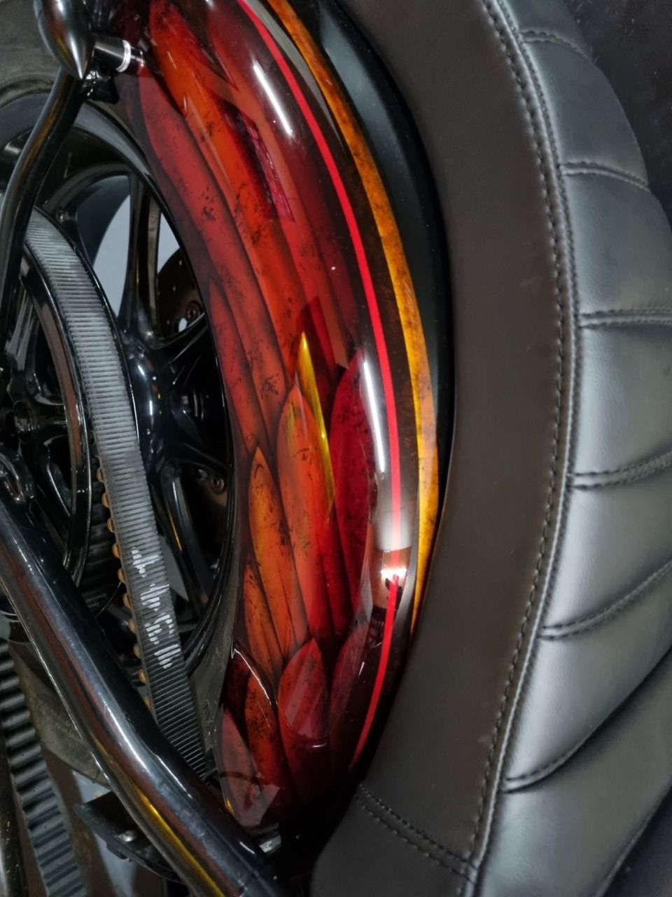 A close up of a motorcycle with a red fender