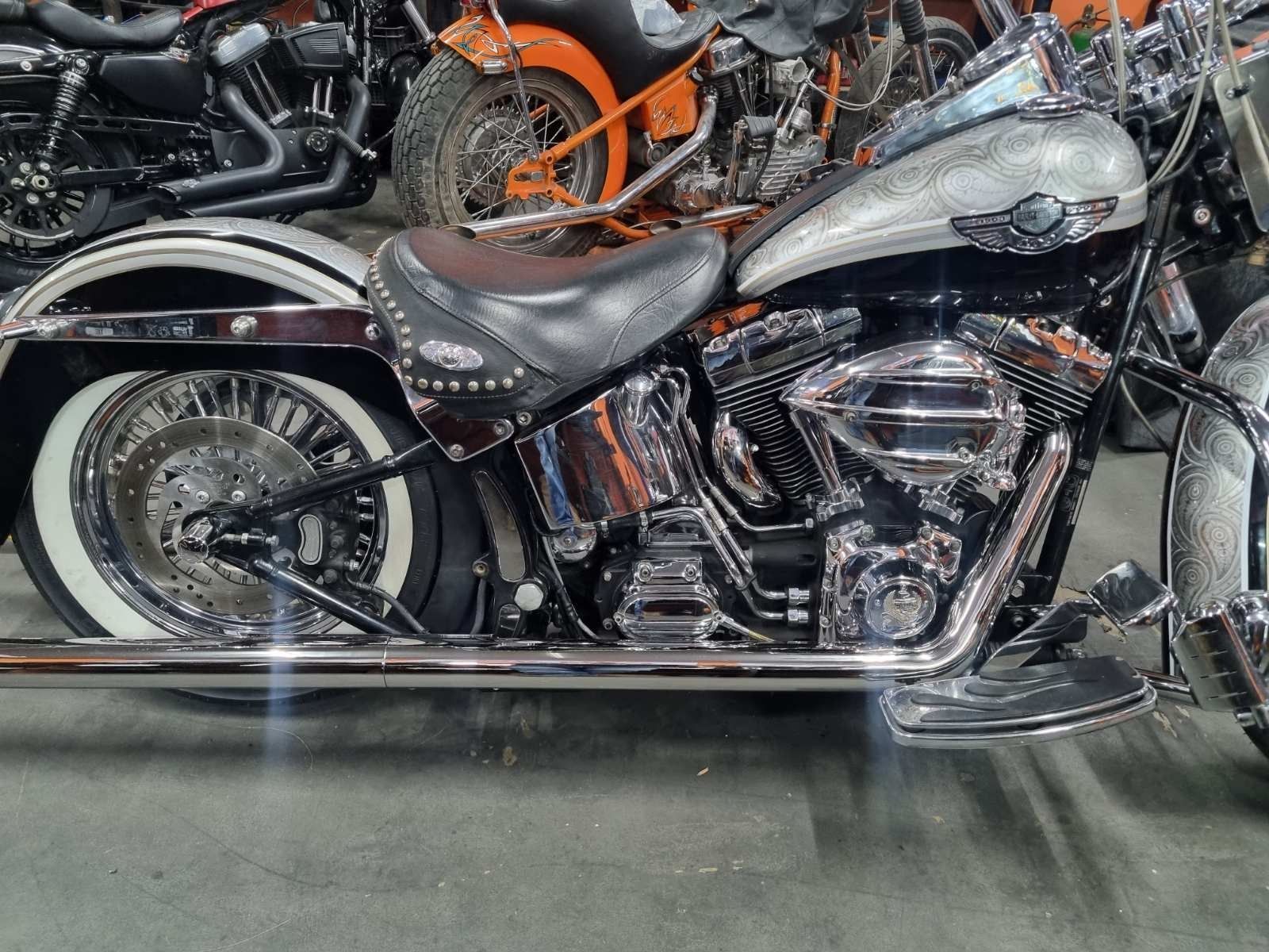 A harley davidson motorcycle is parked in a garage.