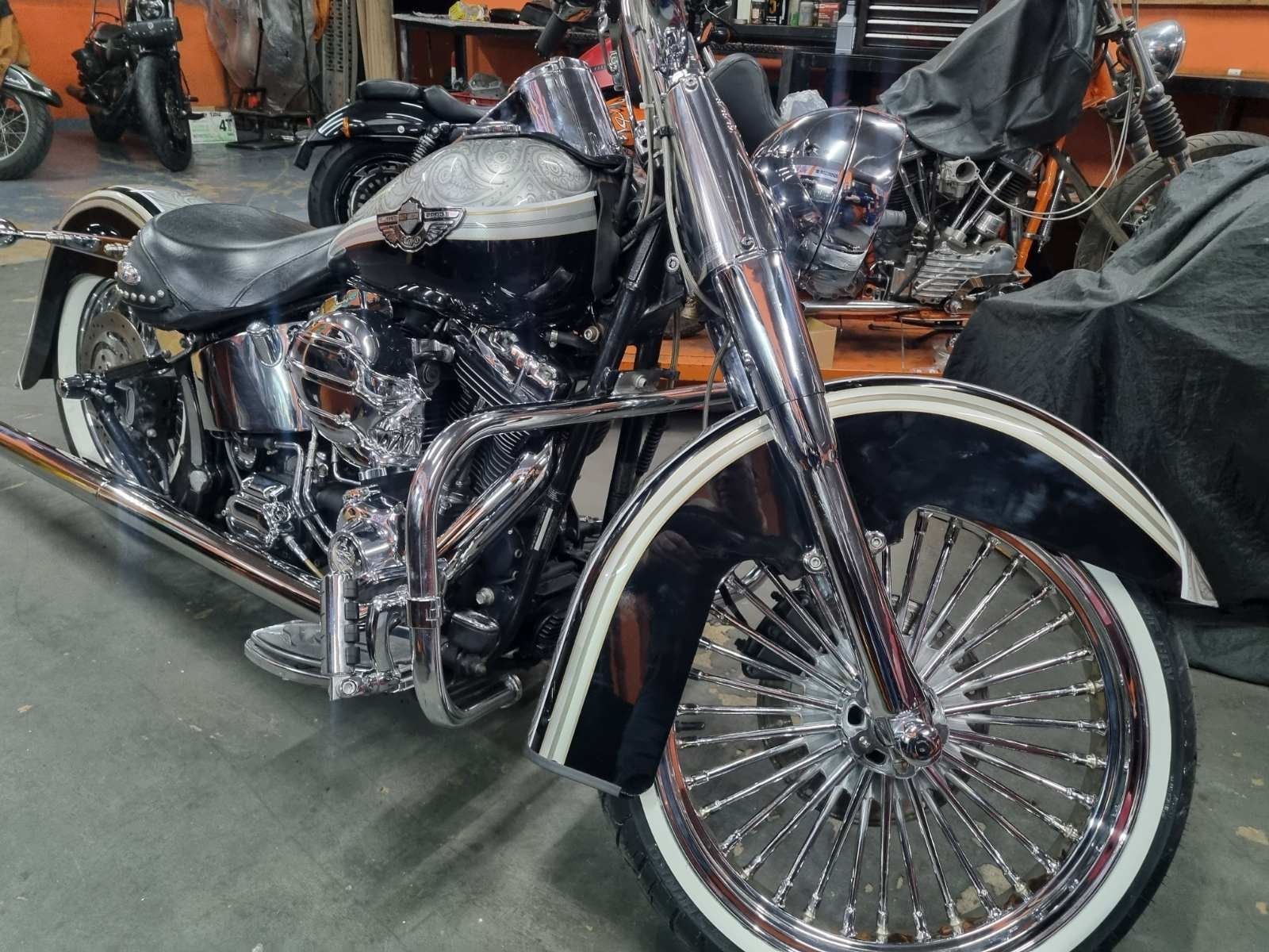A harley davidson motorcycle is parked in a garage