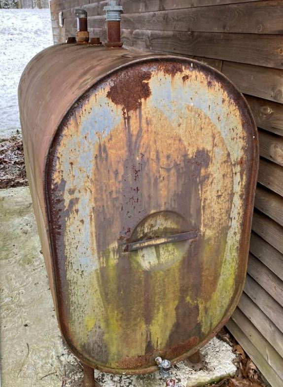 old oil tank with rust outside