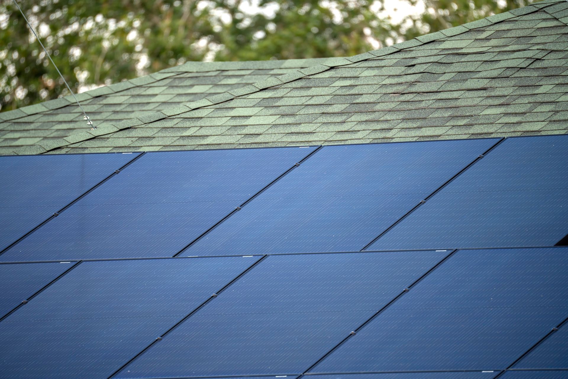 A close up of a roof with solar panels on it.