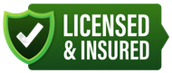 A green sign that says licensed and insured with a check mark on it.